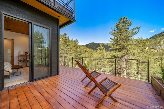 365 Bow Mountain Rd, Boulder, CO 80302 - wooden terrace with a view of trees and a mountain view