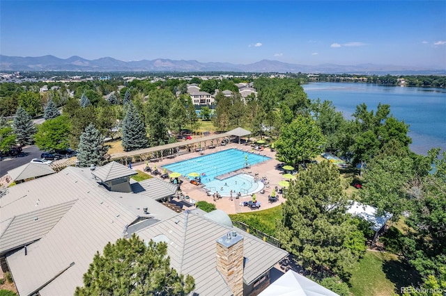 drone / aerial view with a water and mountain view