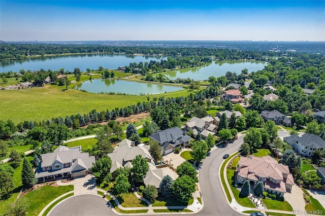 birds eye view of property featuring a residential view and a water view