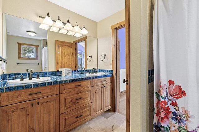 bathroom featuring double vanity and a sink