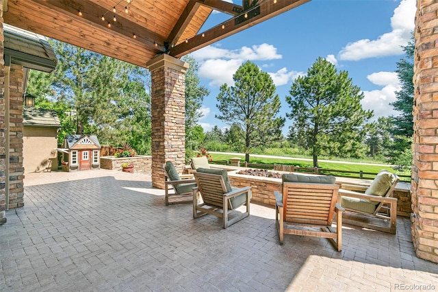 view of patio featuring an outbuilding