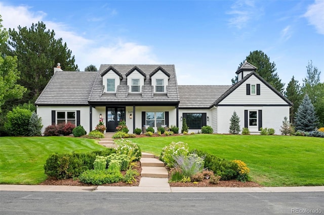 5698 Green Oaks Dr, Greenwood Village, CO 80121 - cape cod house with a front yard and a chimney