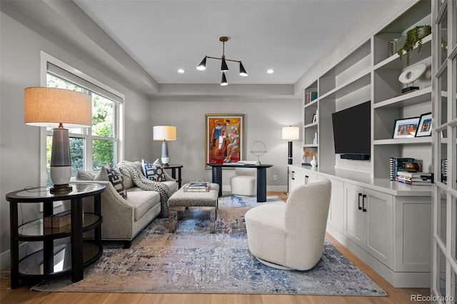 5698 Green Oaks Dr, Greenwood Village, CO 80121 - living area featuring wood finished floors, baseboards, recessed lighting, and built in shelves