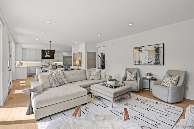 5698 Green Oaks Dr, Greenwood Village, CO 80121 - living area featuring light wood-style floors, recessed lighting, and a chandelier