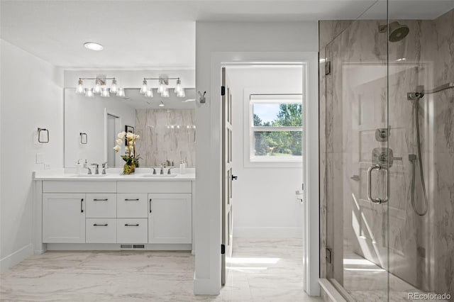 5698 Green Oaks Dr, Greenwood Village, CO 80121 - full bath with marble finish floors, a marble finish shower, baseboards, double vanity, and recessed lighting