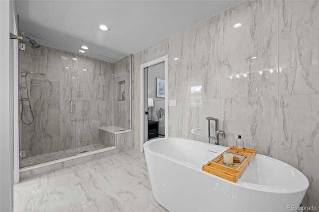 5698 Green Oaks Dr, Greenwood Village, CO 80121 - bathroom featuring a marble finish shower, a freestanding bath, recessed lighting, connected bathroom, and tile walls