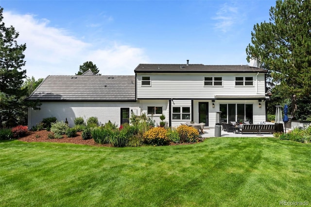 5698 Green Oaks Dr, Greenwood Village, CO 80121 - back of property featuring a lawn, a patio area, and a chimney