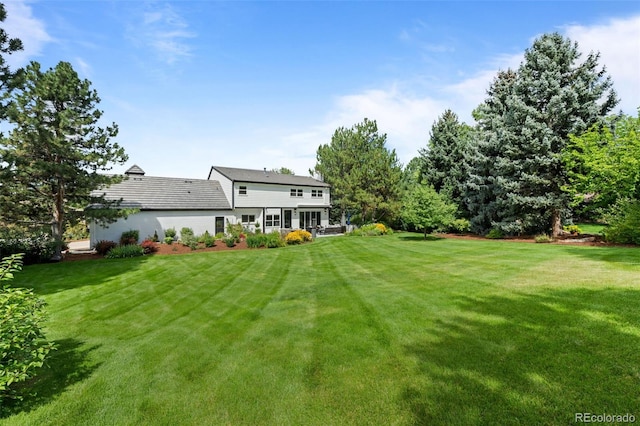 5698 Green Oaks Dr, Greenwood Village, CO 80121 - back of house featuring a lawn