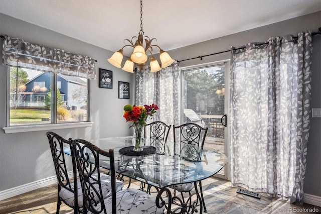 dining room with a chandelier and wood-type flooring