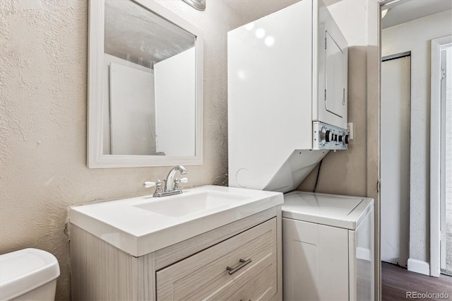 bathroom with vanity, wood-type flooring, and toilet