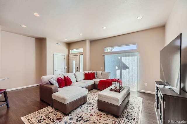 living room featuring dark wood-type flooring