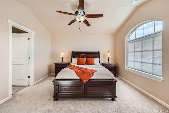 bedroom with ceiling fan, light carpet, and lofted ceiling