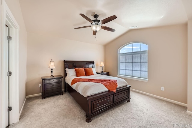 bedroom featuring light carpet, visible vents, lofted ceiling, and baseboards