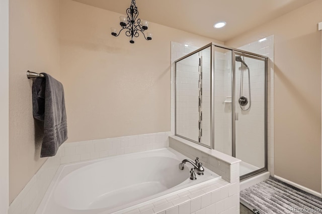6916 Crestop Pl Unit F, Parker, CO 80138 - bathroom with a bath, a stall shower, and recessed lighting
