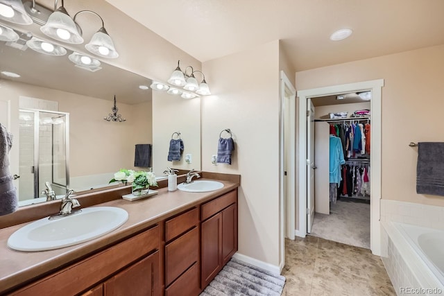 6916 Crestop Pl Unit F, Parker, CO 80138 - bathroom with a stall shower, a garden tub, double vanity, and a walk in closet