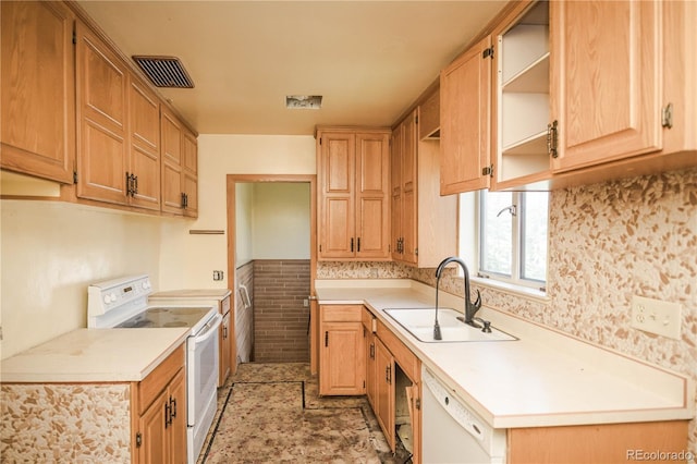 1195 Boston St, Aurora, CO 80010 - kitchen with white appliances, a sink, open shelves, light countertops, and wainscoting