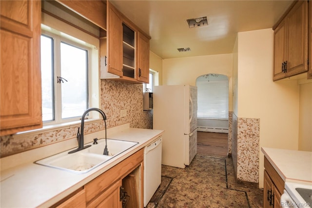 1195 Boston St, Aurora, CO 80010 - kitchen featuring white appliances, a sink, a baseboard radiator, and light countertops