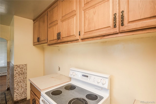 1195 Boston St, Aurora, CO 80010 - kitchen featuring electric stove, light countertops, and baseboard heating