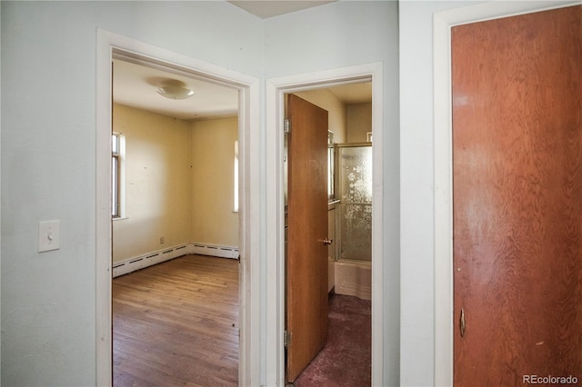 1195 Boston St, Aurora, CO 80010 - hall featuring wood finished floors and a baseboard radiator