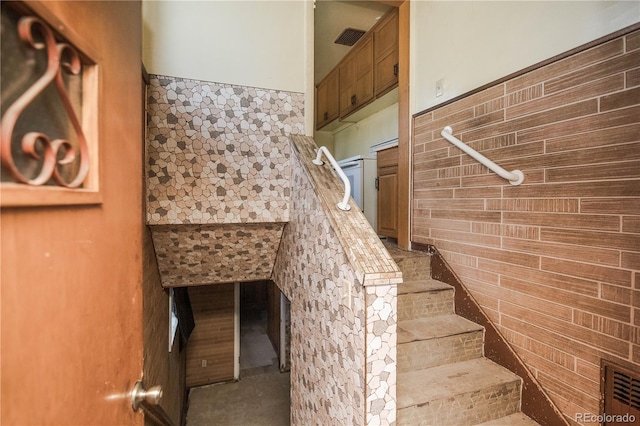 1195 Boston St, Aurora, CO 80010 - stairs featuring tile walls