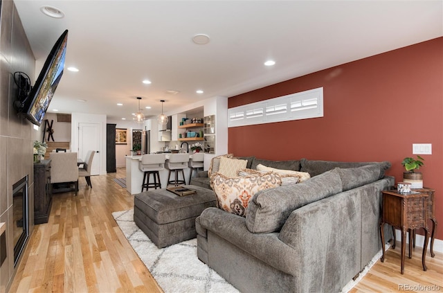 living room featuring recessed lighting and light wood-style flooring