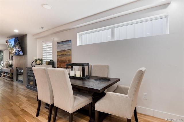 dining space featuring recessed lighting, wood finished floors, visible vents, and baseboards