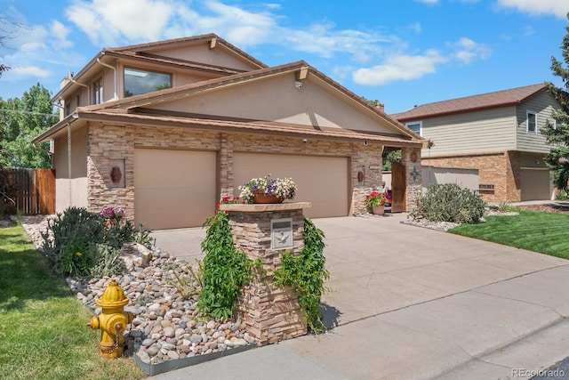 11241 E Cimmarron Dr, Englewood, CO 80111 - view of front of home featuring stucco siding, stone siding, driveway, and a garage