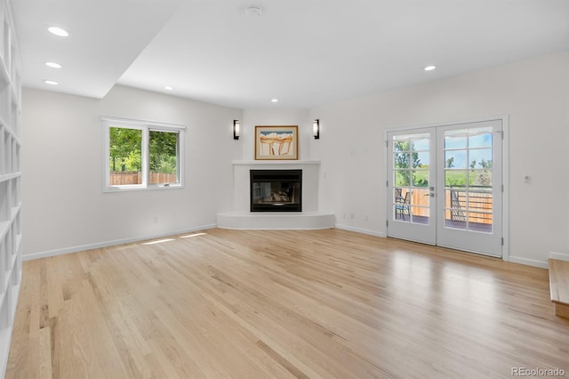 11241 E Cimmarron Dr, Englewood, CO 80111 - unfurnished living room with a glass covered fireplace, plenty of natural light, light wood-style floors, and recessed lighting