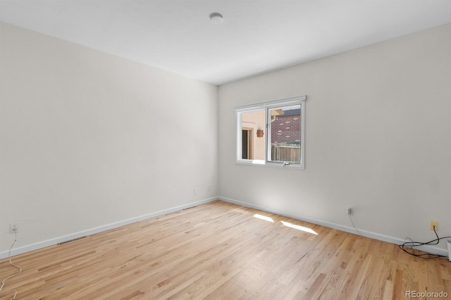 11241 E Cimmarron Dr, Englewood, CO 80111 - spare room featuring wood finished floors and a smoke detector