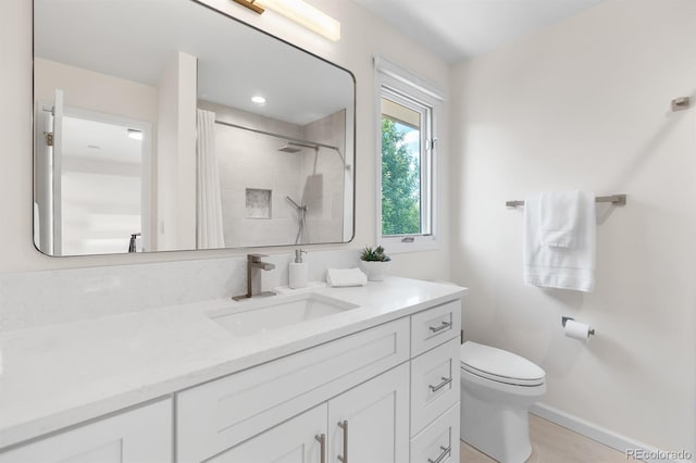 11241 E Cimmarron Dr, Englewood, CO 80111 - bathroom featuring vanity and tiled shower