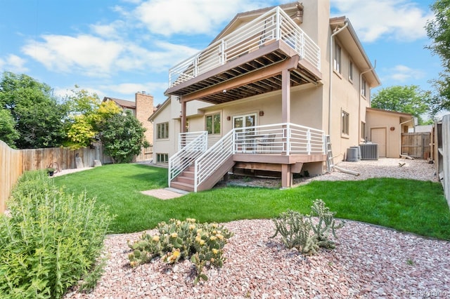 11241 E Cimmarron Dr, Englewood, CO 80111 - rear view of house featuring stucco siding, a fenced backyard, a deck, and a balcony