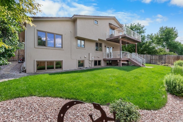 11241 E Cimmarron Dr, Englewood, CO 80111 - rear view of house featuring a balcony, stairway, and stucco siding