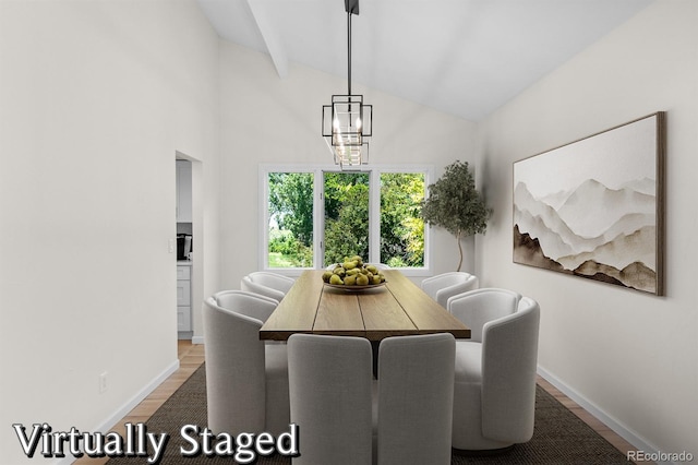 11241 E Cimmarron Dr, Englewood, CO 80111 - dining area with wood finished floors, vaulted ceiling, and a chandelier
