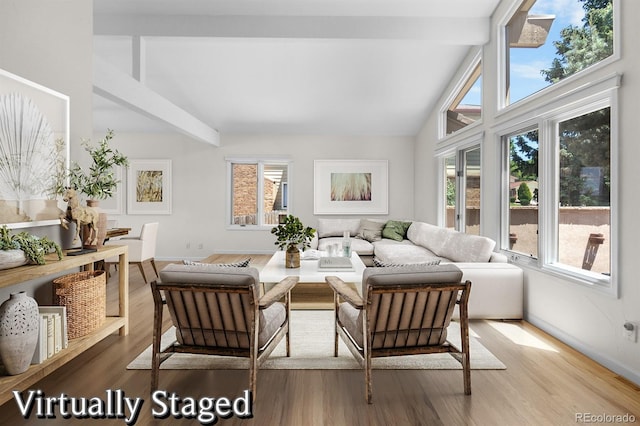 11241 E Cimmarron Dr, Englewood, CO 80111 - living room with beam ceiling, wood finished floors, and high vaulted ceiling