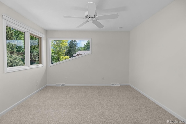 11241 E Cimmarron Dr, Englewood, CO 80111 - spare room with plenty of natural light, carpet, and ceiling fan