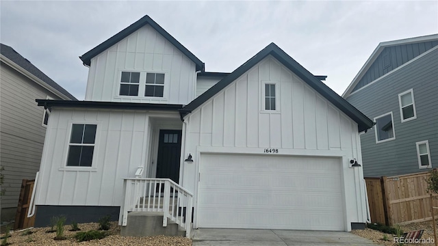 16498 W 92nd Pl, Arvada, CO 80007 - modern farmhouse style home with board and batten siding and concrete driveway