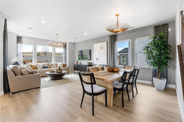 16498 W 92nd Pl, Arvada, CO 80007 - dining area with a chandelier, light wood-type flooring, and recessed lighting