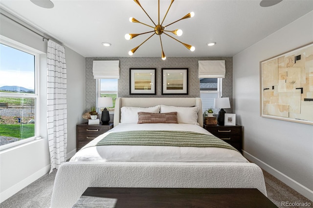 16498 W 92nd Pl, Arvada, CO 80007 - carpeted bedroom with multiple windows, a chandelier, and recessed lighting