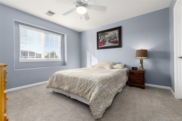 carpeted bedroom with baseboards, visible vents, and ceiling fan