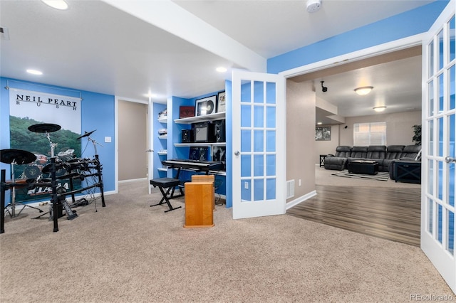 carpeted office with french doors, visible vents, and baseboards