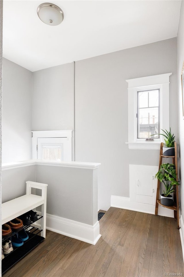 corridor featuring hardwood / wood-style floors