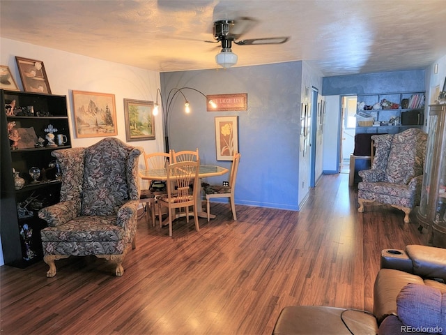 dining room featuring a ceiling fan and wood finished floors