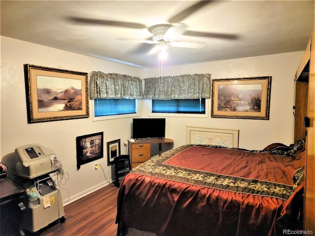 bedroom featuring dark wood finished floors, baseboards, and a ceiling fan