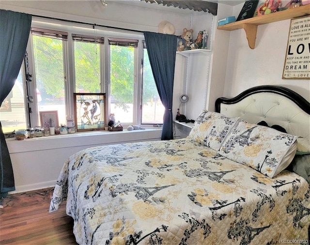 bedroom with wood finished floors