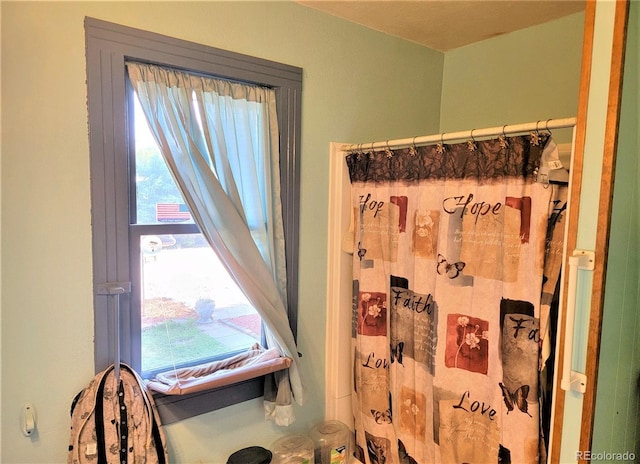 full bath with a shower with curtain