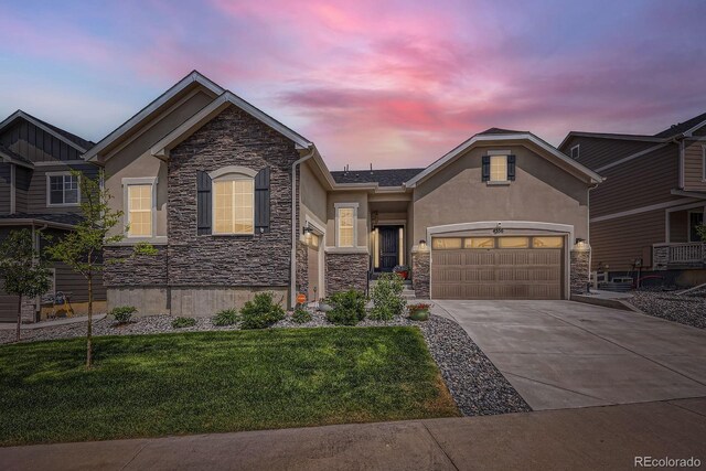 4536 Shady Path Ln, Castle Rock, CO 80104 - view of front of property with stone siding, stucco siding, concrete driveway, and a garage
