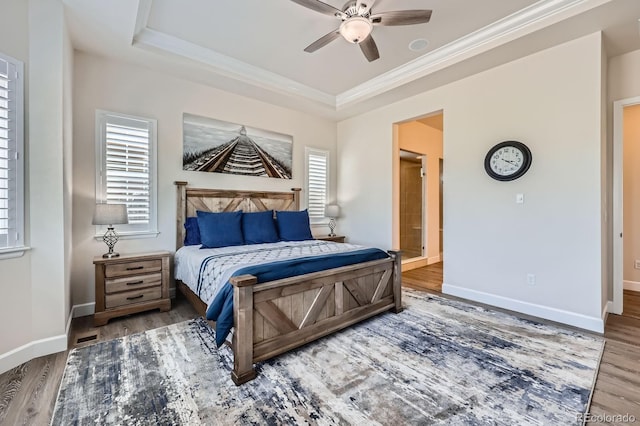 4536 Shady Path Ln, Castle Rock, CO 80104 - bedroom with wood finished floors, a raised ceiling, ornamental molding, and baseboards