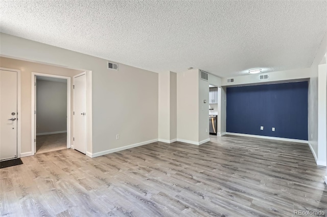 3550 S Harlan St Unit 177, Denver, CO 80235 - unfurnished living room with wood finished floors, a textured ceiling, and baseboards