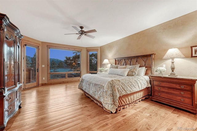 bedroom with ceiling fan, access to outside, and light wood-type flooring