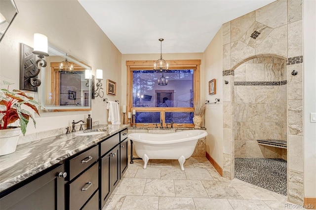 bathroom featuring vanity, separate shower and tub, and a chandelier